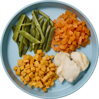 Merluza con verduras y boniato